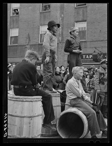 Youngsters watching the men's race at the barrel rolling contest in Presque Isle, Maine