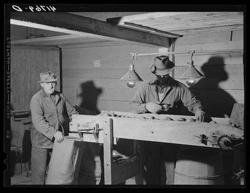 Untitled photo, possibly related to: Workmen at the Woodman Potato Company just finishing lunch in a small room at the store house that serves as a lunchroom. Caribou, Maine