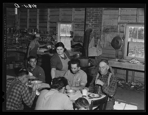 Lunch hour at one of the farms of the Woodman Potato Company. All of the pickers and field laborers eat in this converted tool house, eleven miles north of Caribou, Maine