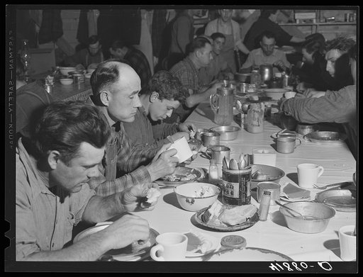 Lunch hour at one of the farms of the Woodman Potato Company. All of the pickers and field laborers eat in this converted toolhouse. Eleven miles north of Caribou, Maine
