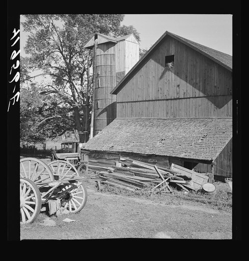 Old boards and rusty nails piled up where they might be dangerous. Farm of Mr. Theodore German. North Branford, Connecticut (safety film)