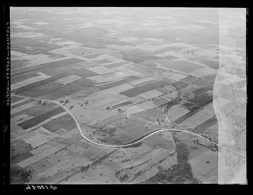 Potato farms in Aroostook County showing the layout of land. The highway curving in the foreground is U.S. 1. See general caption no. 1 Aroostook County