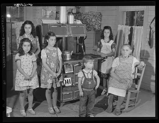 The children and mother of Mr. Patrick Dummond, French-Canadian potato farmer in Lille, Maine