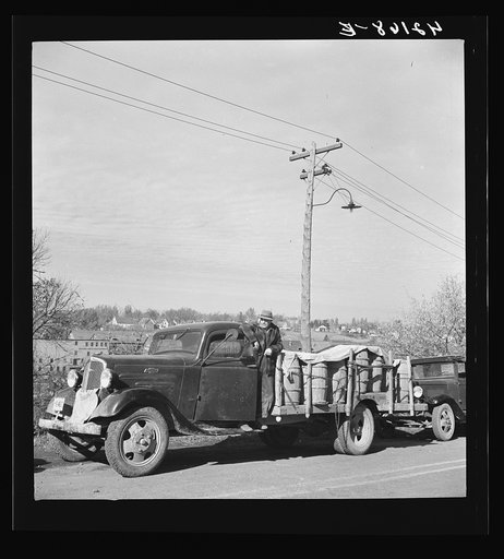 French-Canadian potato farmer waiting his turn in a line at a starch factory in Caribou, Maine to have his potatoes graded and weighed