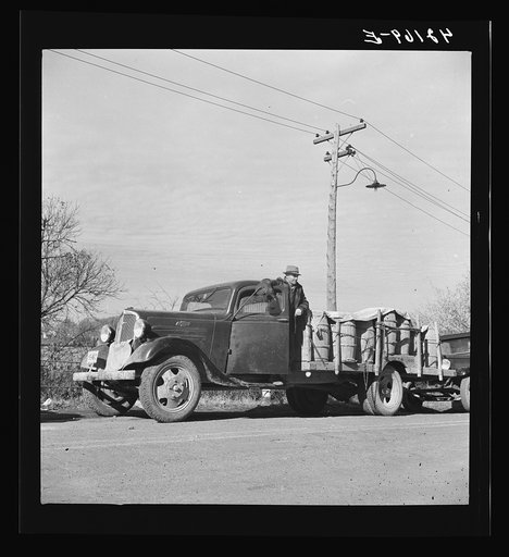 Untitled photo, possibly related to: French-Canadian potato farmer waiting his turn in a line at a starch factory in Caribou, Maine to have his potatoes graded and weighed