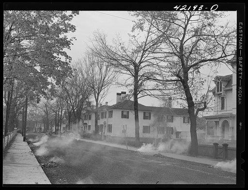 Burning the autumn leaves on Broadway in Norwich, Connecticut