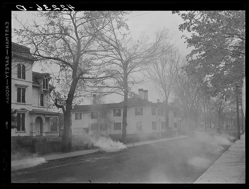 Burning the autumn leaves on Broadway. Norwich, Connecticut