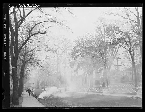 Burning the autumn leaves on Broadway in Norwich, Connecticut