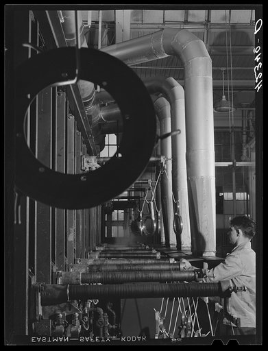 New type of plating machine being used at the Hamilton Standard Propeller Corporation. It automatically dips the part into the proper solutions for the proper lengths of time. East Hartford, Connecticut