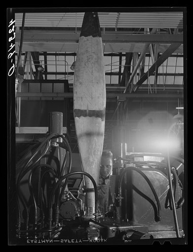 Finishing the base of a rough cut propeller at the Hamilton Standard Propeller Corporation. East Hartford, Connecticut