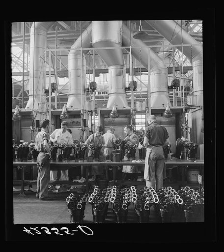 Painting the cylinders of aircraft motors at the Pratt and Whitney Plane. East Hartford, Connecticut