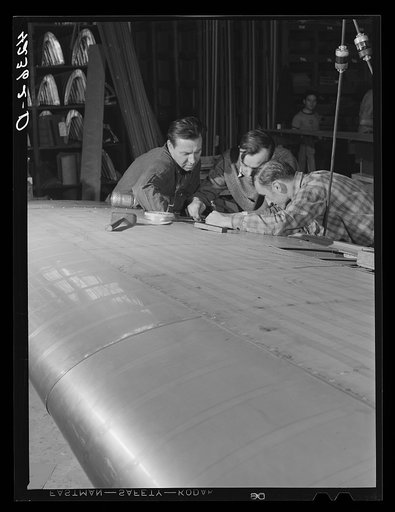 Working on an aileron assembly of a wing at the Vought Sikorsky Aircraft Corporation. Stratford, Connecticut