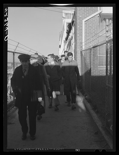 Untitled photo, possibly related to: Workmen leaving the plant at Vought Sikorsky Aircraft Corporation. Stratford, Connecticut