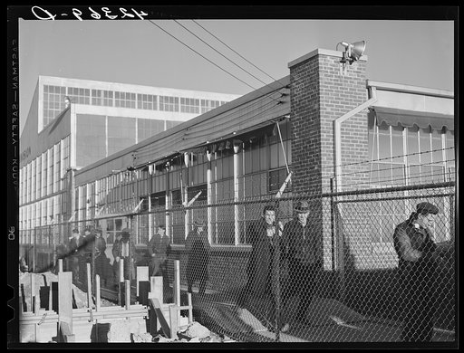 Workmen leaving the plant at the Vought Sikorsky Aircraft Corporation. Stratford, Connecticut