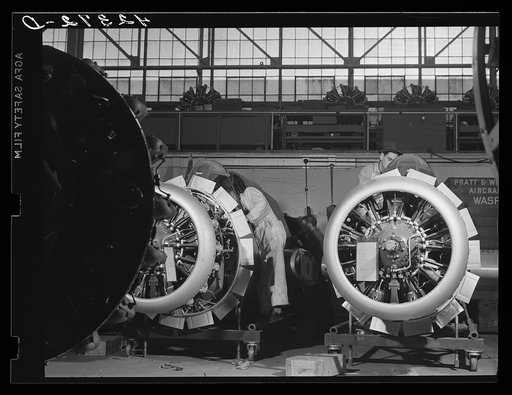Workmen on the final assembly of a plane at the Vought Sikorsky Aircraft Corporation. Stratford, Connecticut