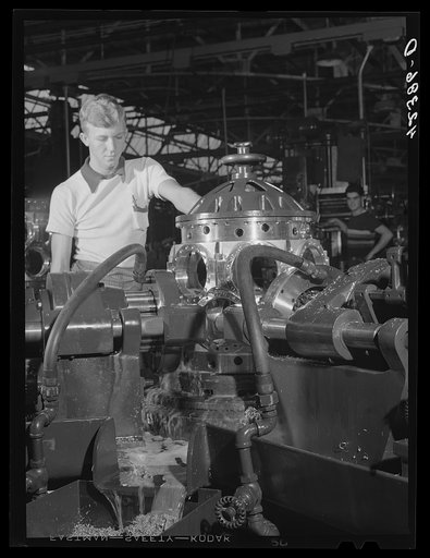 Working on an aircraft engine casing at the Pratt and Whitney Aircraft plant in East Hartford, Connecticut