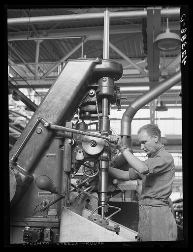 A drill press in operation at the Pratt and Whitney Aircraft Corporation. East Hartford, Connecticut