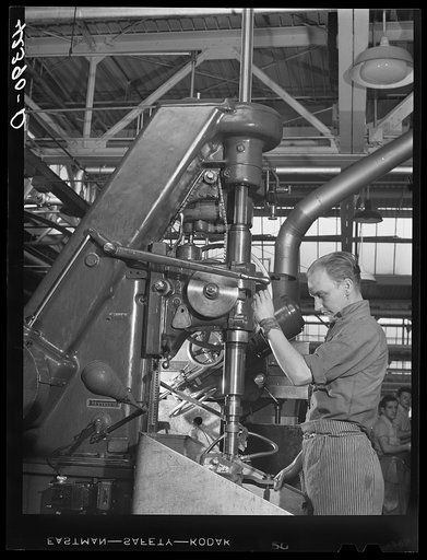 A drill press in operation at the Pratt and Whitney Aircraft Corporation. East Hartford, Connecticut