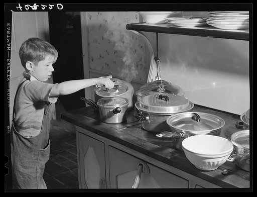 One of the Crouch children looking to see if the "pudd'n" is ready for their Thanksgiving dinner. Ledyard, Connecticut
