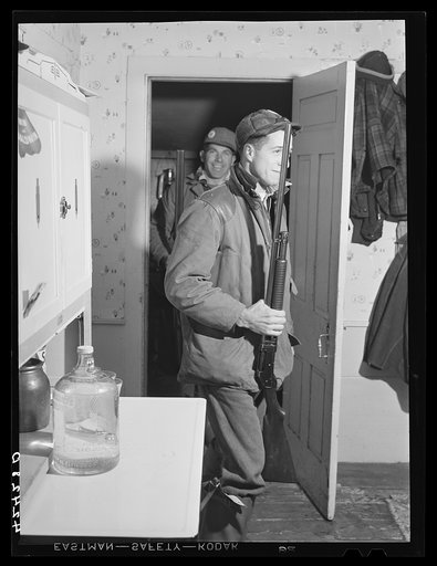 Two of the Crouch family boys coming home for the Thanksgiving Day dinner after a morning of hunting in the woods. Ledyard, Connecticut