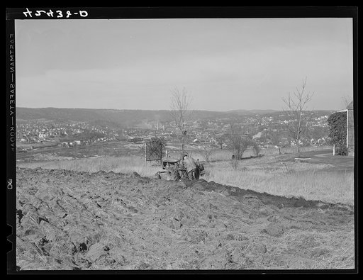 Untitled photo, possibly related to: Farmer ploughing his field on a hillside opposite the industrial valley including the towns of Darby, Shelton, and Ansonia, Connecticut