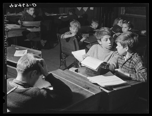Boys in the schoolhouse in Ledyard, Connecticut, working on the school newspaper