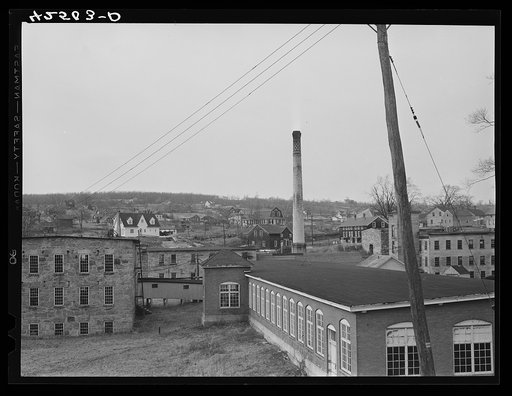 Untitled photo, possibly related to: An old textile mill in Montville, Connecticut. In the background are small subsistence farms
