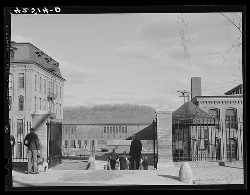 Untitled photo, possibly related to: Employees leaving the Denomah Mills in Taftville, Connecticut, at the end of the afternoon shift