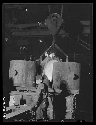 Emptying a ladle of molten steel at the foundry of the Farrell-Birmingham Corporation. Ansonia, Connecticut