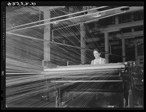 Girl worker at the Denomah Mills, Taftville, Connecticut. Makers of rayon and cotton cloths