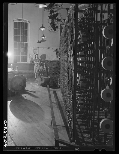 Winding cotton thread in the Denomah Mills, Taftville, Connecticut. Makers of rayon and cotton cloths