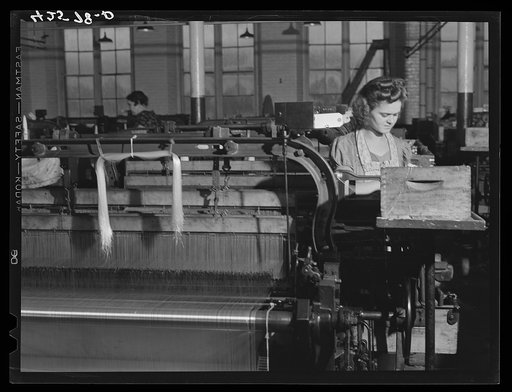 Untitled photo, possibly related to: At a loom in the Denomah Mills, Taftville, Connecticut. Makers of cotton and rayon cloths