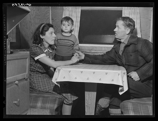 Mr. and Mrs. Clyde Burton and child. Mr. Burton came from Moose Head Lake region, Maine, where he used to run a sportsman's camp. Have been traveling around in a trailer for three years. Had a few weeks work at one of the branches of the iron works a number of months ago, has been unemployed since. 