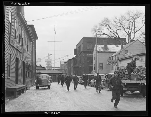 Men coming out of the shipyard at noon hour for lunch. Bath, Maine