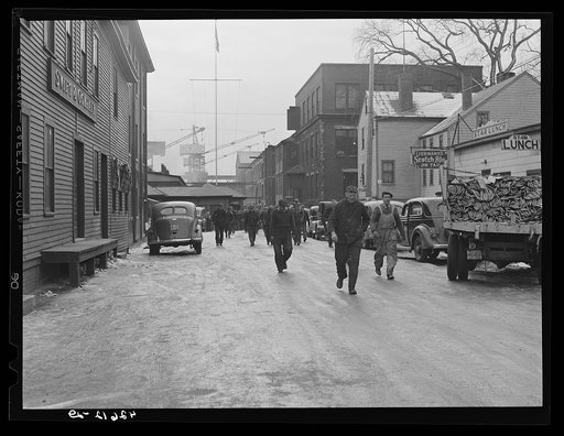 Men coming out of the shipyard at noon hour for lunch. Bath, Maine