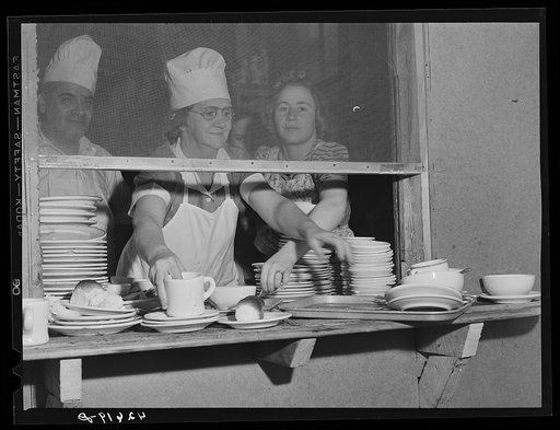 Pile of dishes in kitchen of the Star Lunch, where two hundred shipyard workers come for lunch. Bath, Maine