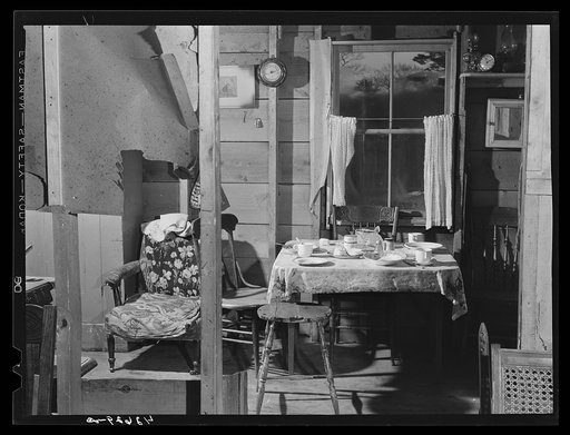 Inside the home of Ralph Hart, a worker at the shipyards. Their house is one of a small settlement of shacks and houses that are springing up a few miles out of Bath