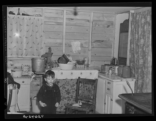 The small son of Mrs. Carol Porter. Mr. Porter works at shipyard. They used to farm near Whitefield, Maine. Came to Bath three months ago. Lived in a small shack until they were able to get their house built. They are still working on their house