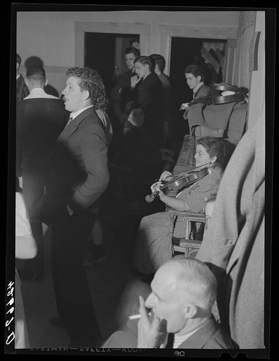 Untitled photo, possibly related to: Music for the Saturday night square dances in Clayville, Rhode Island, is provided by this school teacher from a neighboring town and her son. They are also available for parties and weddings