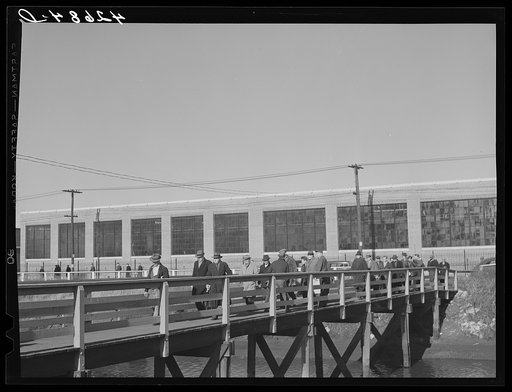 Men leaving the plant of the Browne and Sharpe Manufacturing Company, Providence, Rhode Island, at end of shift