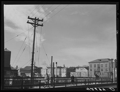 Untitled photo, possibly related to: Textile mills seen from a bridge in Woonsocket, Rhode Island