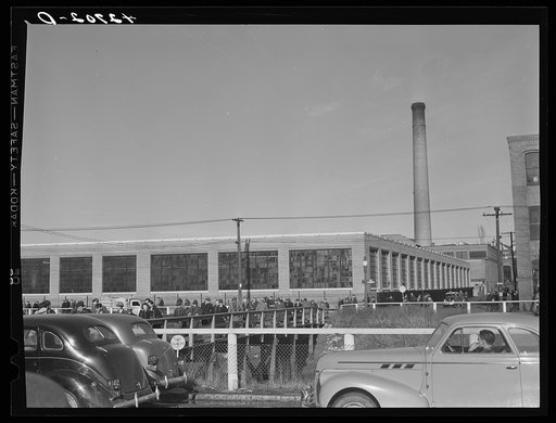 Untitled photo, possibly related to: Men leaving the Browne and Sharpe Manufacturing Company in Providence, Rhode Island at the end of the shift