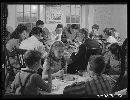 The family of Mr. Timothy Levy Crouch, a Rogerine Quaker, at their annual Thanksgiving Day dinner. A twenty-pound turkey was dispensed with in short order. Ledyard, Connecticut