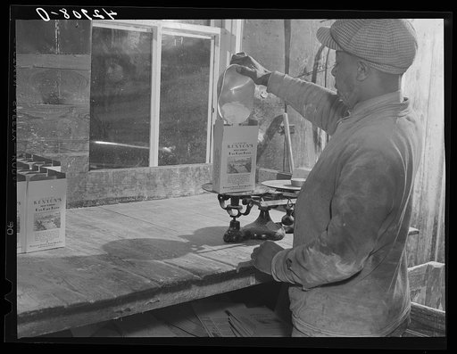 Filling pound boxes of Kenyon's pancake flour at the old mill in Usquepaugh, Rhode Island