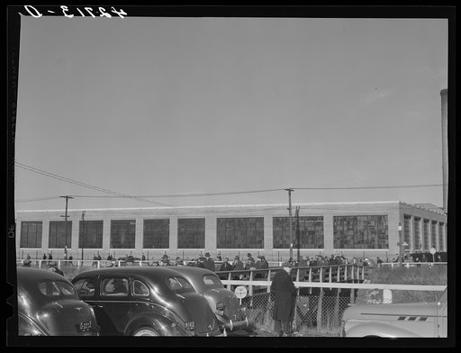Untitled photo, possibly related to: Men leaving the Browne and Sharpe Manufacturing Company in Providence, Rhode Island at the end of the shift