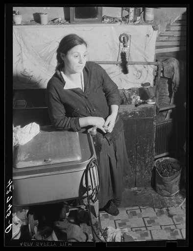 Mrs. M. Vieta, Portuguese wife of a FSA (Farm Security Administration) client. At present she is looking after the farm and the children while her husband works at the torpedo station in Newport. Portsmouth, Rhode Island