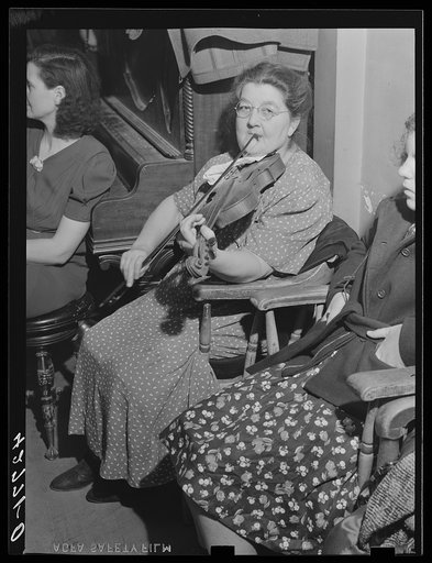 Music for the Saturday night square dances in Clayville, Rhode Island, is provided by this school teacher from a neighboring town and her son. They are also available for parties and weddings