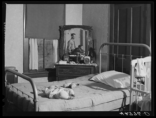 Family living in the "crackerbox" slum tenement in Beaver Falls, Pennsylvania