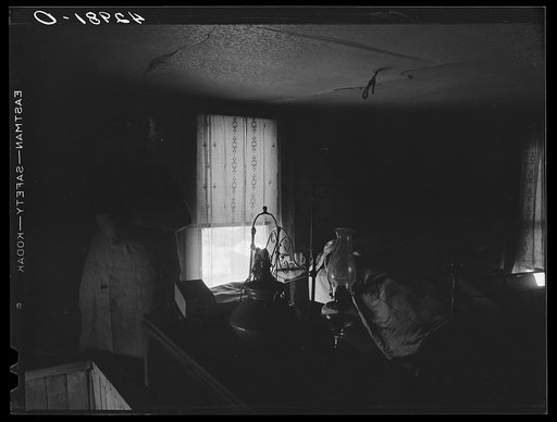 Untitled photo, possibly related to: Woman in dilapidated old house in the Mount Washington district of Beaver Falls, Pennsylvania. She is blind in one eye and her other one is going bad too. She expressed the hope that she would lose her sight completely so she could get some money from blind pensi