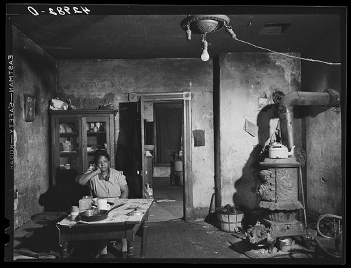 Negro woman in a dilapidated house in the Mount Washington district of Beaver Falls, Pennsylvania